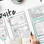 Image of a group reviewing a web design wireframe.