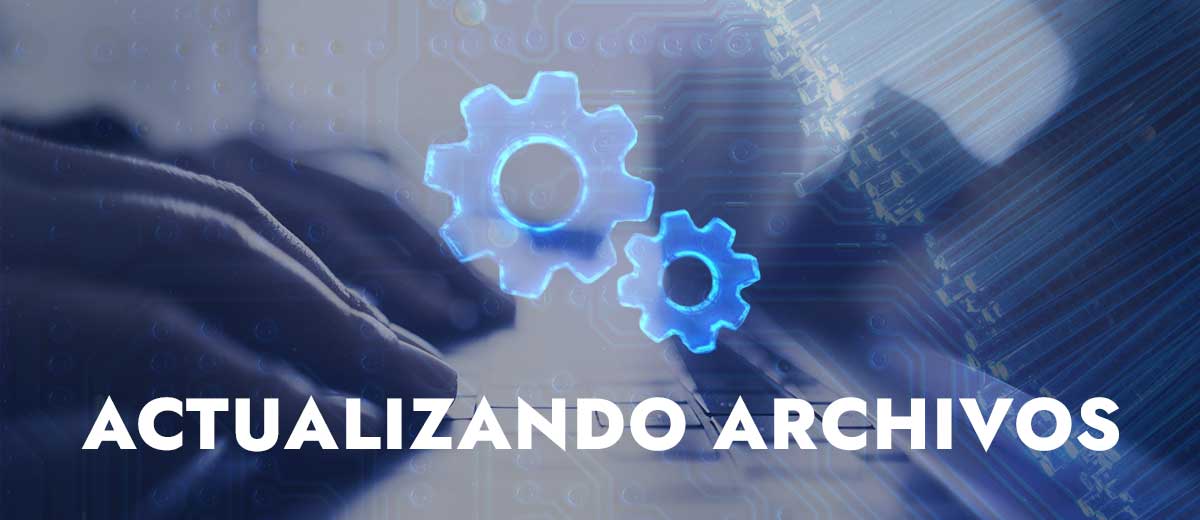 imagen de una persona escribiendo en su laptop con las palabras “Actualizando archivos” superpuestas.